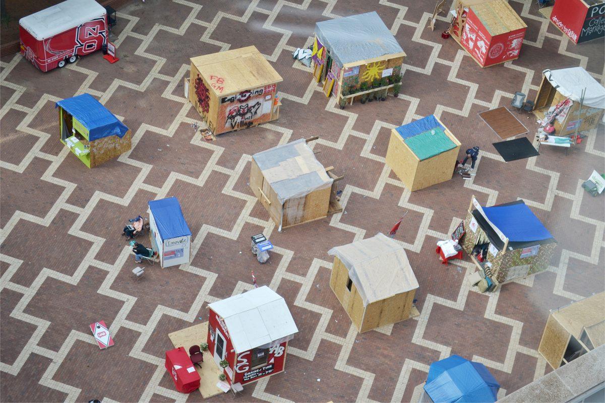 Handmade shacks dot the brickyard during Shack-A-Thon 2013. The week-long annual event aims to raise awareness about homelessness and raise money for Habitat for Humanity. Photo by Caide Wooten.