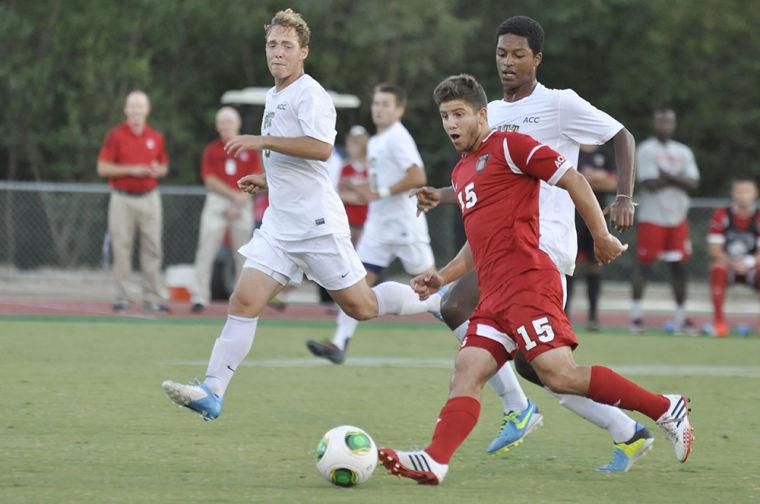 Senior Midfield, Alex Martinez dribbles the ball down the field against the Pittsburgh Panthers in Dail Soccer Field Friday, September 6, 2013. Martinez shot on the Panthers two times in the 1 to 0 game. Photo by Joseph Phillips