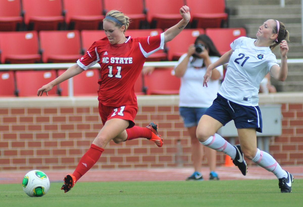 Sophomore forward Brittany Stanko crosses the ball into the box against East Tennessee State University Sunday, September 1, 2013. The Wolfpack defeated the Buccaneers 3-0 at Dail Soccer Field. Photo by Ryan Parry.
