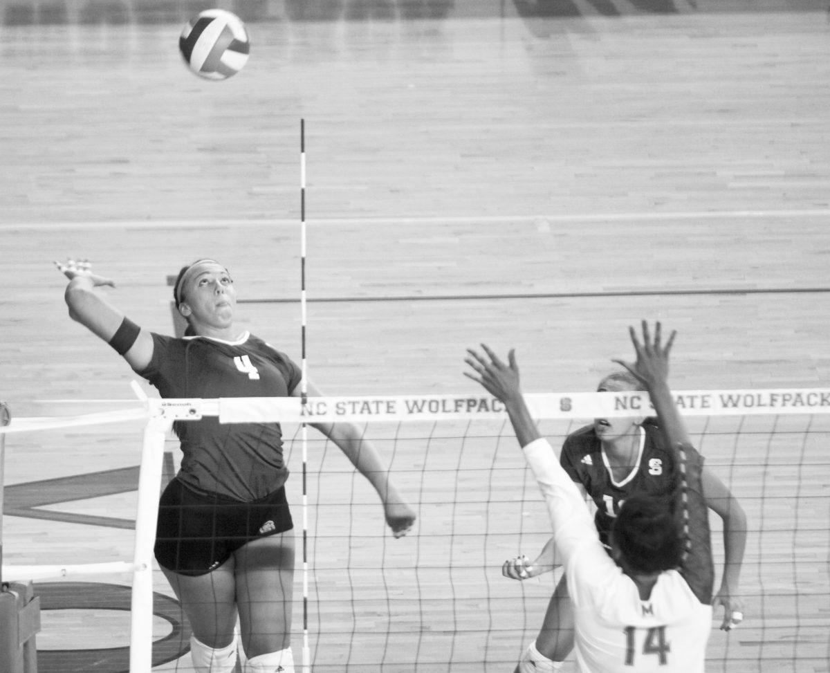 Junior Outside Hitter Rachel Buckley prepares to spike the ball against Maryland. The Terrapins lost to the Wolfpack 3-1 on Saturday, Oct. 26, 2013.