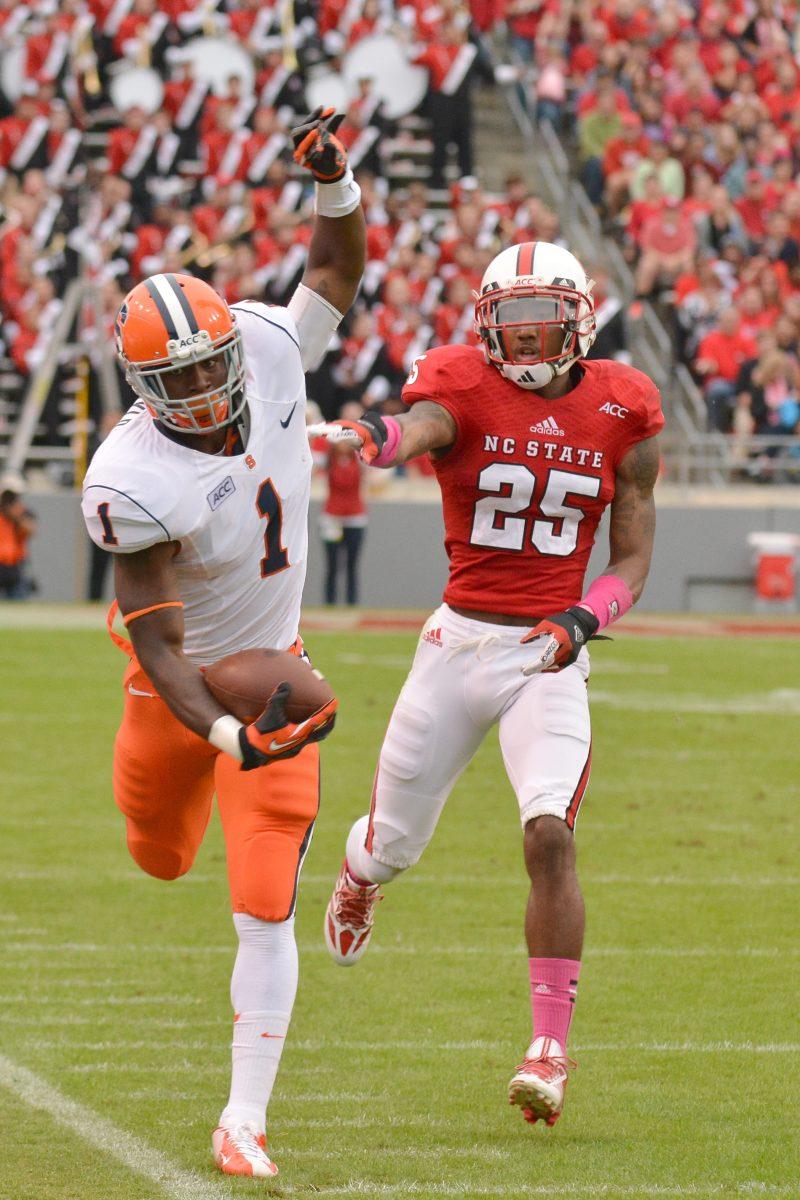 Senior cornerback Dontae Johnson pushes the Syracuse ball carrier out of bounds during the football game against new ACC member Syracuse in Carter-Finley Stadium Saturday, Oct. 11, 2013. The Orange defeated the Wolfpack 24-10, dropping N.C. State to 0-3 in conference play.