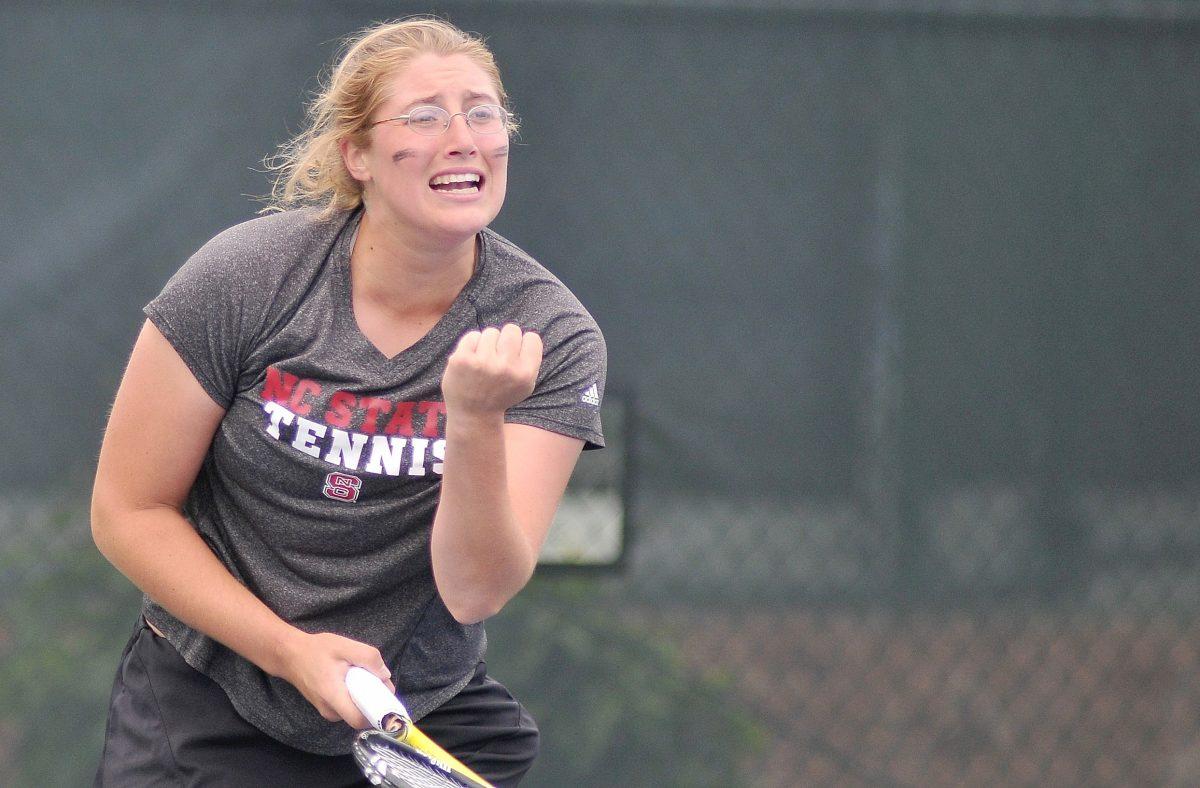 Senior Joelle Kissell fist pumps after she and her doubles partner, senior Tatiana Illova, score a point against Boston College Thursday, April 25, 2013. The Wolfpack defeated the Eagles 4-1 in round one of the ACC Tournament at Cary Tennis Center.