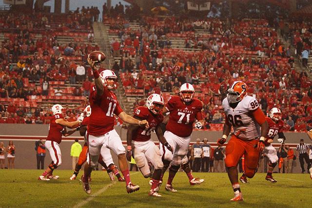 Sophomore Garrett Leatham attempts a pass in the third quater against Syracuse. Photo By Eric Engstrom