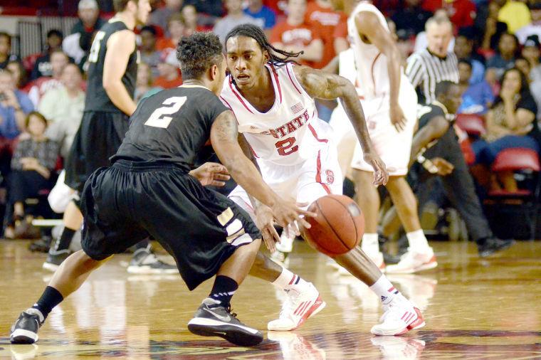 Freshman guard Anthony Barber plays defense during the first half against UNC Pembroke Wednesday, October 30, 2013. The Wolfpack led the Braves 44-37 at the half at Reynolds Coliseum.