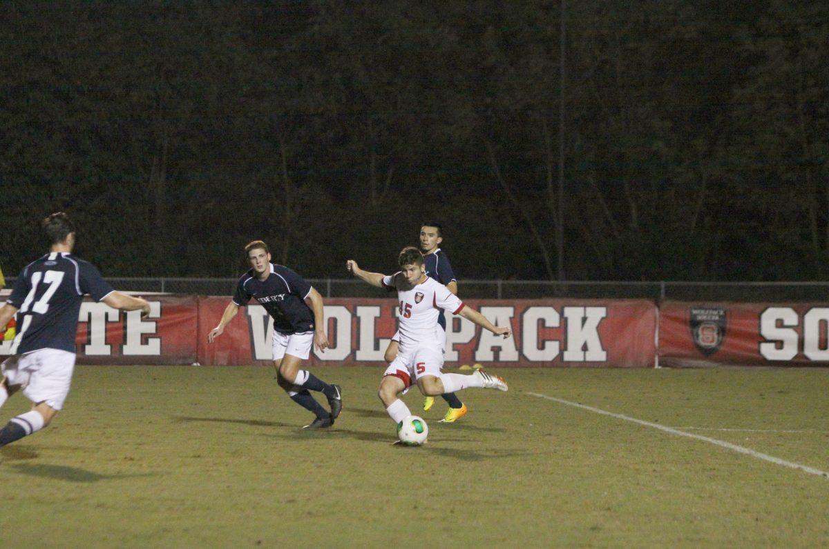 Alex Martinez, number 15 of N.C. State, shoots to score the second and final goal of the game versus Liberty.