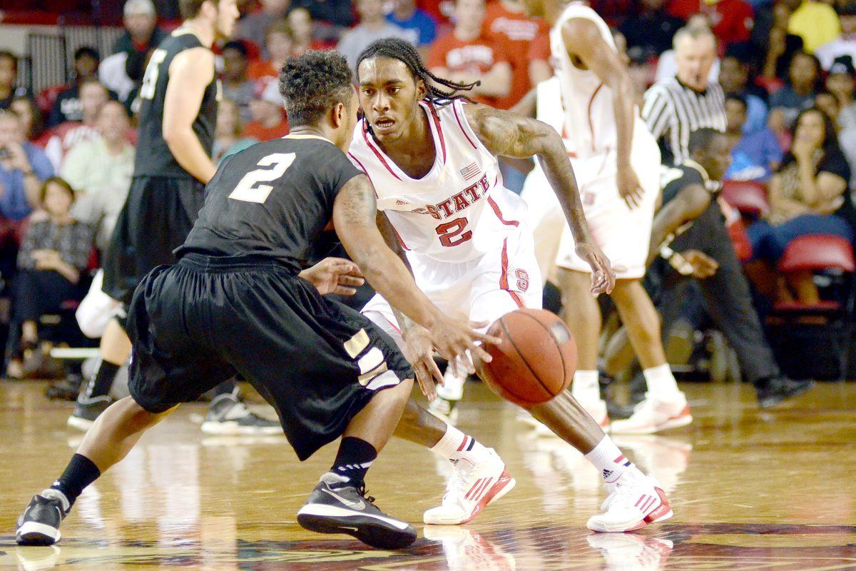 Freshman guard Anthony Barber plays defense during the first half against UNC Pembroke Wednesday, October 30, 2013. The Wolfpack led the Braves 44-37 at the half at Reynolds Coliseum.