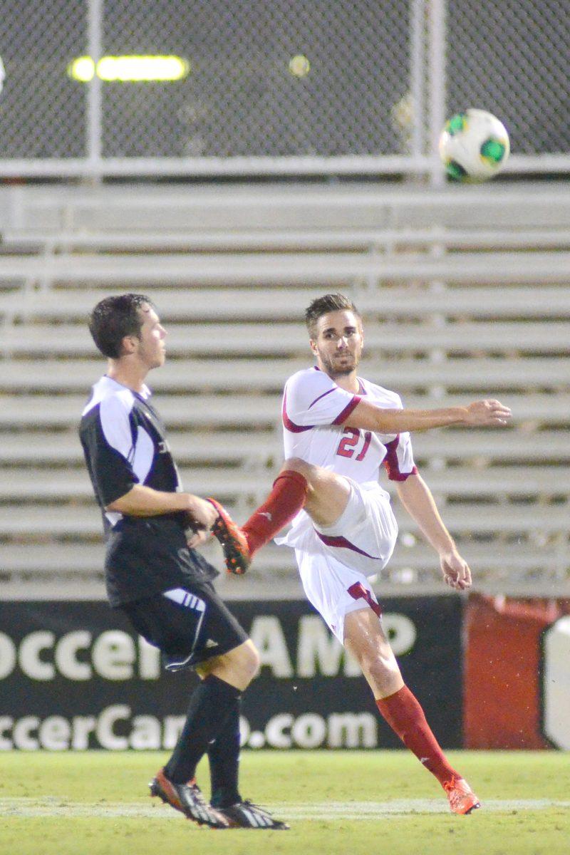 Junior defender Clement Simonin passes the ball during soccer match against new Davidson at Dail Soccer Field Tuesday, Sept. 24, 2013. The Wolfpack defeated the Wildcats 2-0.