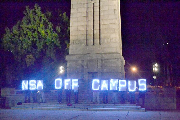 More than 30 students demonstrated against the NSA&#8217;s presence on campus Monday at the Bell Tower.