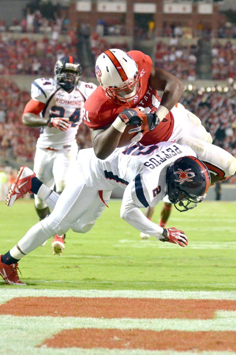 Freshman running back Matt Dayes dives into the end zone during the football game against the University of Richmond in Carter-Finley Stadium Saturday, Aug. 31, 2013. The Wolfpack narrowly defeated the Spiders, 23-21.