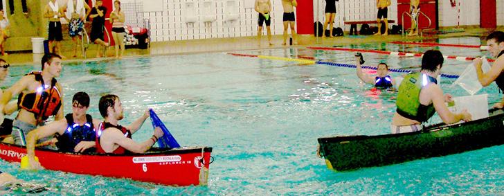 N.C. State students conduct a marine battle in the Carmichael Gymnasium pool as they&#160;participate in a Pool Battleship competition in 2011. The goal of the competition is to sink the&#160;opposing team&#8217;s canoes by filling them with water.
