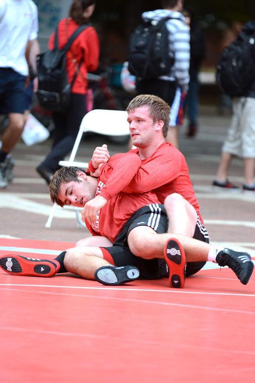 Sophomore Keegan Cerwinski puts teammate freshman Mikey Armorando hold on Tuesday, Oct. 8, 2013. Photo by Joseph Phillips