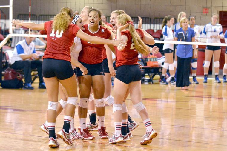 The women's volleyball team celebrates winning a point during the volleyball match against Duke in Reynolds Coliseum on Oct. 13. The Wolfpack beat the Blue Devils, 3-1.