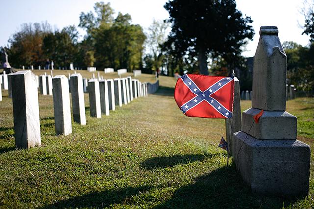 Confederate flag waves in the wind at the Confederate Cemetery within Oakwood Cemetery Oct. 27, 2013.