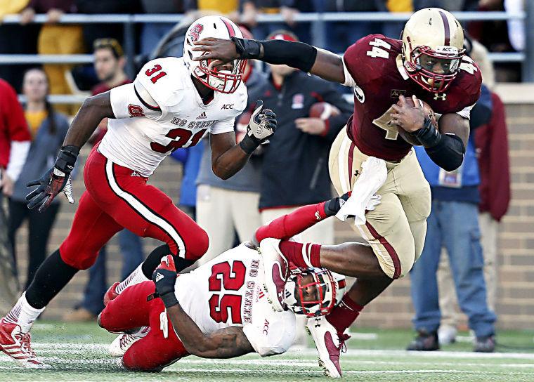 Boston College senior running back Andre Williams breaks the tackle of N.C. State&#8217;s senior cornerback Dontae Johnson. Williams ran for a school-record 339 yards in the Eagles&#8217; 38-21 win over the Wolfpack on Saturday.&#160;