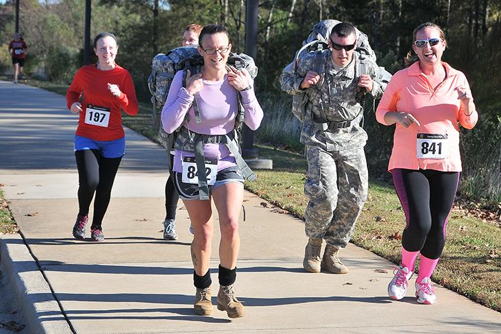&#160;
Runners carry military backpacks while participating in the inaugural Run, Walk and Roll with Veterans 5K on Centennial Campus Sunday. The race was an opportunity for participants to show their support for veterans who have served the United States.&#160;