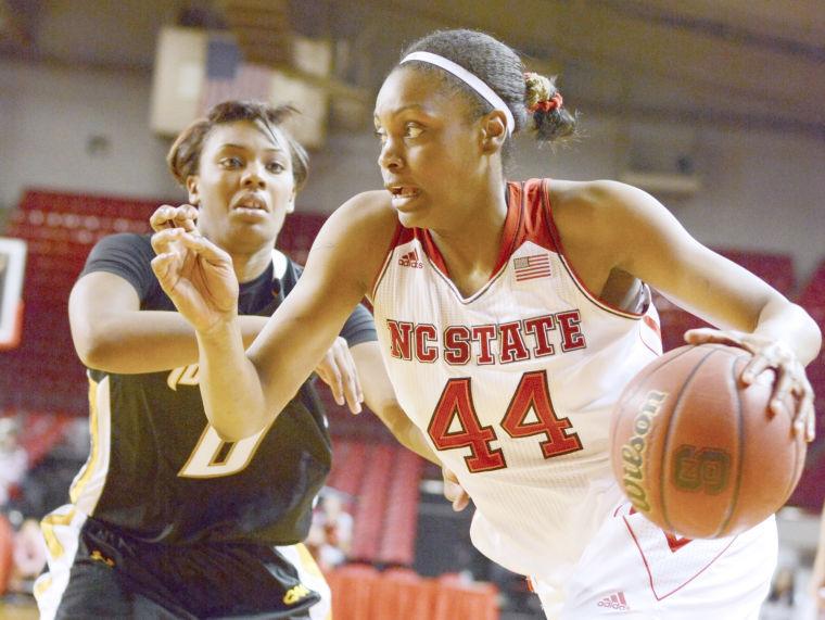 Senior forward Kody Burke drives the ball Monday at Reynolds Coliseum against Towson. The Wolfpack defeated the Tigers, 69-46.