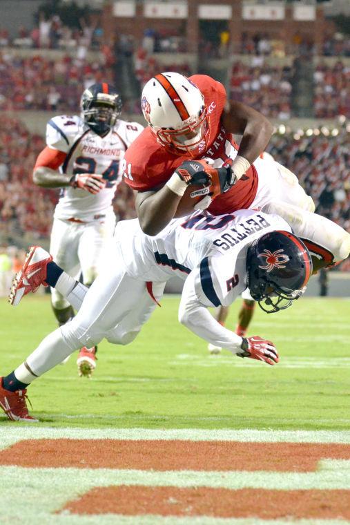 Freshman running back Matt Dayes dives into the end zone during the football game against the University of Richmond in Carter-Finley Stadium Saturday, Aug. 31, 2013. The Wolfpack narrowly defeated the Spiders, 23-21.