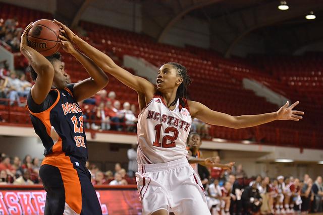 Junior guard Krystal Barrett tries to knock the ball loose during the game against Morgan State in Reynolds Coliseum on Monday. Barrett contributed eight points to the Wolfpack&#8217;s 94-52 victory over the Bears&#160;