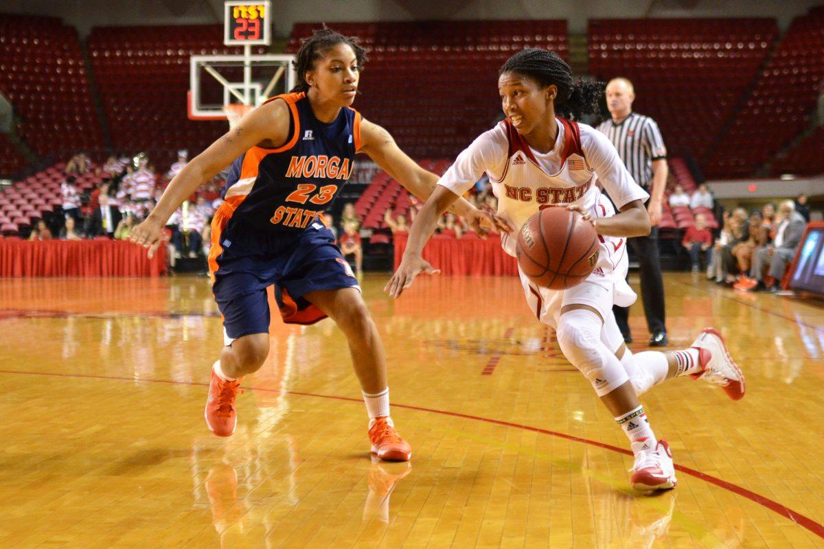 Redshirt junior guard Len'Nique Brown drives around the defense during the game against Morgan State in Reynolds Coliseum Monday, Nov. 18, 2013. Brown contributed 4 assists to the Wolfpack&#8217;s 94-52 victory.