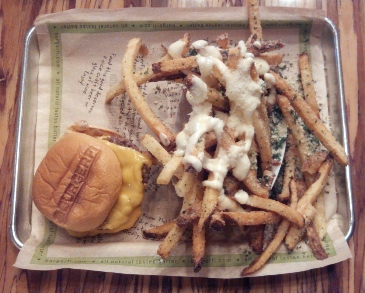 Burgerfi serves thinly sliced, beef-patty burgers and offers a great variety of french fry toppings, such as &#8220;urban&#8221; fries, which are pictured above and feature garlic aoli and parmesan cheese.