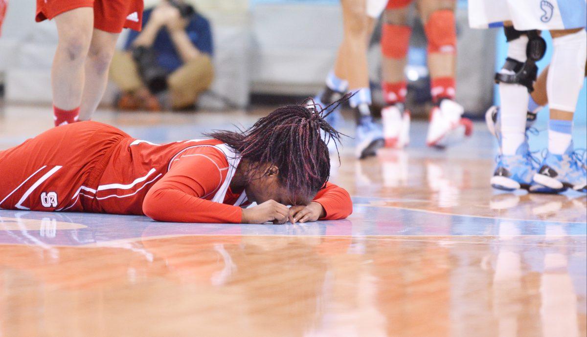 Freshman forward Jennifer Mathurin pauses before getting up after falling during the game against North Carolina in Chapel Hill on Thursday, Jan. 9, 2014. The Wolfpack fell to the Tar Heels 79-70, State's first conference loss and just its second loss this season.