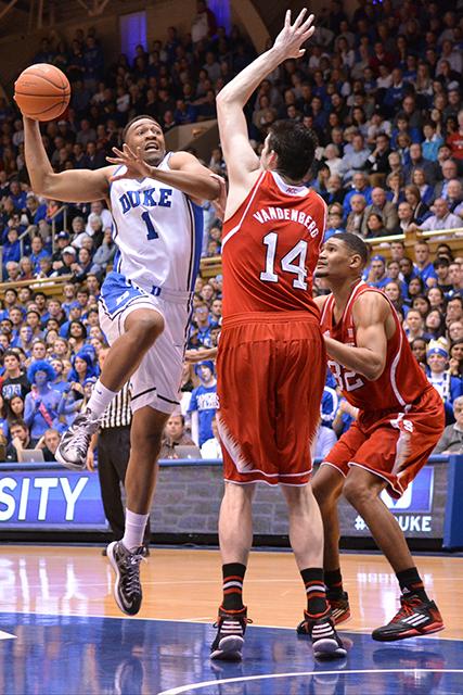 Redshirt senior center Jordan Vandenberg attempts to block a shot during the game against Duke in Cameron Indoor Stadium Jan. 18, 2013. The Blue Devils remain undefeated at home after their resounding 95-60 defeat of the Wolfpack.&#160;