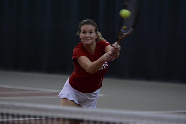 Freshman Natalia Janowicz hits a backhand volley during N.C. State&#8217;s match against East Carolina. Janowicz and her teammate Taylor Zaytoun won their doubles match, helping the Wolfpack defeat the Pirates, 7-0.