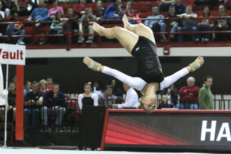 Senior Hannah Fallanca tumbles across the floor on Jan. 17 in Reynolds Coliseum during the floor exercise portion of the competition. The Wolfpack took second place with 195.650 points to Michigan. Fallanca scored 9.625 points on her floor exercise routine.&#160;