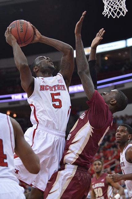Junior guard Desmond Lee takes a contested shot during the game against Florida State in PNC Arena Jan. 29. Lee scored 11 points in the Wolfpack&#8217;s 74-70 victory over the Seminoles.