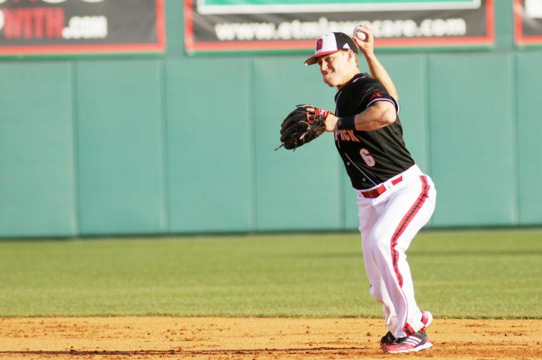 Junior second baseman Logan Ratledge throws the ball to first base during N.C. State&#8217;s 6-5 victory over Appalachian State at Doak Field on Feb. 21.