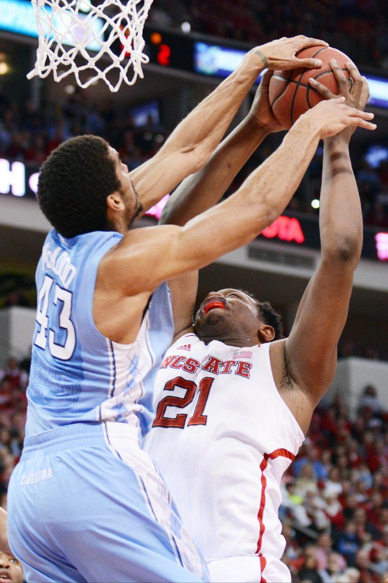 Forward freshman BeeJay Anya tries to shoot the ball against North Carolina in PNC Arena Wednesday. The Wolfpack fell to the Tar Heels in overtime, 85-84.
