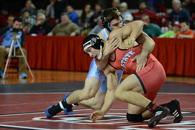 Freshman Michael Macchiavello (184) wrestles against UNC-Chapel Hill&#8217;s Alex Utley. Utley defeated Macchiavello, but N.C. State recorded a 19-16 victory over the Tar Heels in the ACC dual Jan. 31 in Reynolds Coliseum.
