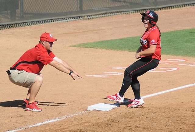 Senior outfielder Bethaney Wells screams as she stops at third base during the game against UNC-Chapel Hill on April 13, 2013. Wells went one-for-three with two earned runs in the Wolfpack&#8217;s 11-8 win over the Tar Heels.