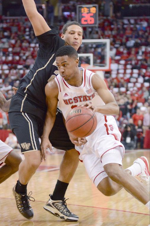 Junior guard Ralston Turner drives past a Wake Forest defender in State&#8217;s game against the Demon Deacons on Feb. 11 at the PNC Arena. Turner scored 16 points, helping the Wolfpack defeat the Deacs, 82-67.