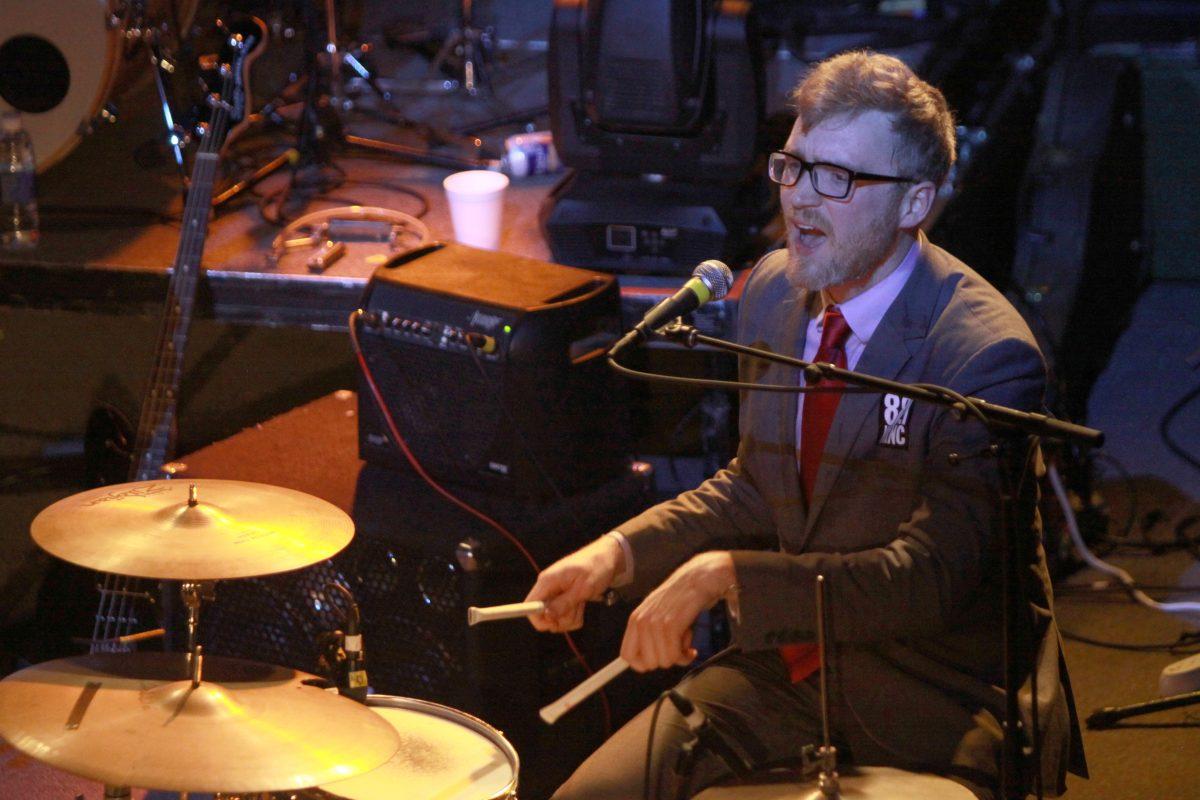 Bombadil's James Philips sings and plays the drums during WKNC's Double Barrel Benefit Friday at Lincoln Theatre.&#160;