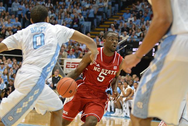 Junior guard Desmond Lee drives to the basket during the game against North Carolina in the Dean Smith Center in Chapel Hill Saturday, Feb. 1, 2014. Lee had 18 points and three assists in the Wolfpack&#8217;s 84-70 loss to the rival Tar Heels. Photo by John Joyner