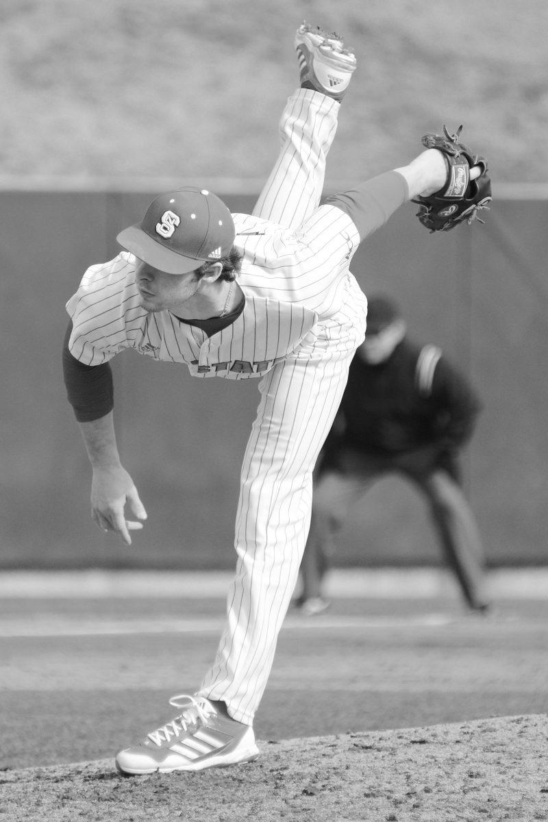 Junior pitcher Logan Jernigan throws a pitch Monday at Doak Field against Canisius. Jernigan&#8217;s pitching helped the Wolfpack defeat the Golden Griffins, 11-4.
