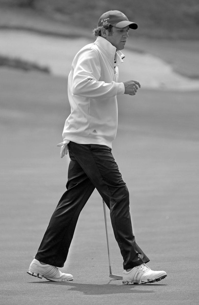 N.C. State senior golfer Logan Harrell walks off the green after making a putt. Harrell was State&#8217;s best performer in Puerto Rico, posting a score of +1 for the tournament.