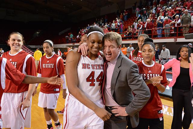 Senior forward Kody Burke and head coach Wes Moore celebrate after No. 14 N.C. State&#8217;s win over Virginia in Reynolds Coliseum Sunday. Burke scored the go-ahead 3-pointer for the Wolfpack with 11 seconds left in the contest.