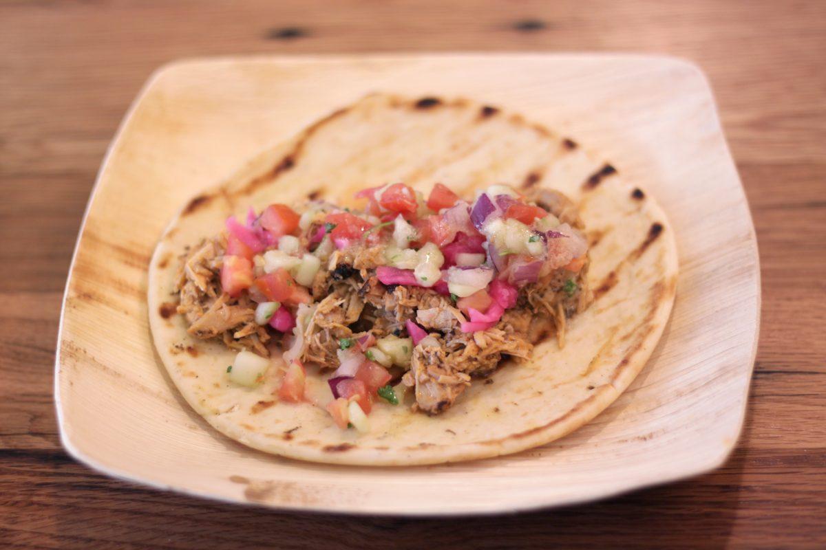 Chicken Shawarma from One Earth - Marinated chicken, pickled turnips, garlic sauce and greek salsa served on a pita.