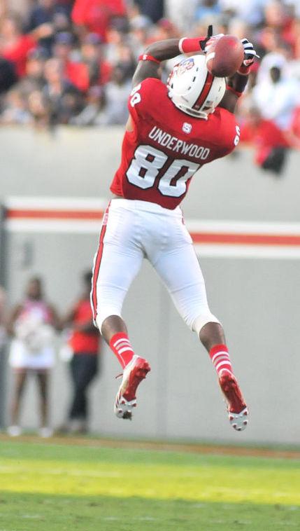 Redshirt junior wide receiver Bryan Underwood jumps to catch a pass against Richmond Sept. 7. Underwood had 21 receiving yards in the Wolfpack's 23-21 win over the Spiders at Carter-Finley Stadium.