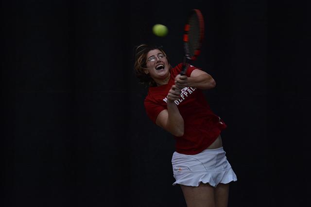 Senior Joelle Kissell hits a backhand against East Carolina&#8217;s senior Melis Tanik at the J.W. Isenhour Tennis Center Jan. 24. Kissell&#8217;s 6-0, 6-1 win helped the Wolfpack defeat the Pirates, 7-0.
