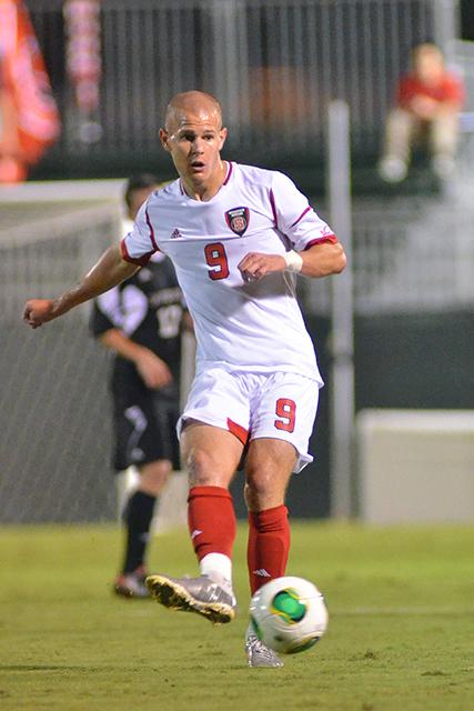 Redshirt junior forward Nick Surkamp passes the ball during N.C. State&#8217;s soccer match against Davidson at Dail Soccer Field Sept. 24, 2013. Surkamp, State&#8217;s leading scorer in 2013, scored the Wolfpack&#8217;s first goal Friday against the Carolina Railhawks, helping the Pack secure a 2-2 draw.
