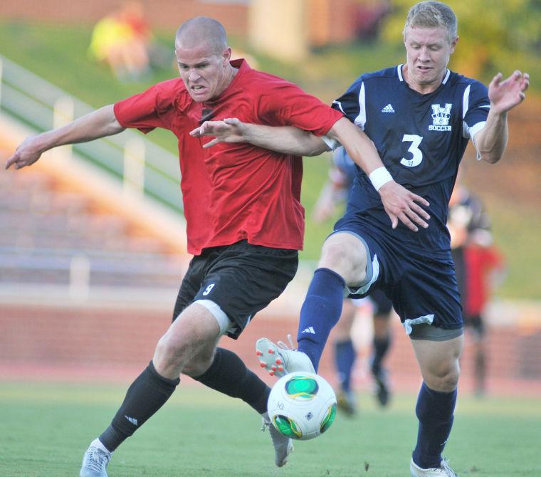 Senior forward Nick Surkamp fights to gain possession of the ball in N.C. State&#8217;s preseason friendly against UNC-Wilmington Aug. 24, 2013. The Wolfpack tied the Seahawks 1-1 during its exhibition match at Dail Soccer Stadium.