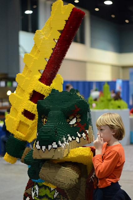 Families and children assembled Saturday at the Raleigh Convention Center at the LEGO KidsFest. The LEGO Fest featured a LEGO Model Museum of characters from fiction. Also featured was a brick pile for children to dive in and put bricks together. Two LEGO Master Builders, Steve Gerling and Chris Steininger, were present to teach tools of the trade that they have learned through their years of building with LEGOs. Gerling and Steininger built most of the models displayed in the Model Museum. As visitors exited the LEGO Fest, they had the opportunity to build a section of the United States and have it placed on a 65 feet long by 45 feet wide. Visitors could view this visitor-made model from a balcony.