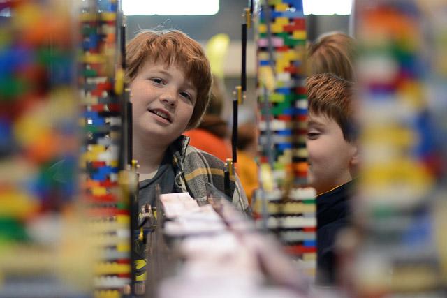 Families and children assembled Saturday at the Raleigh Convention Center at the LEGO KidsFest. The LEGO Fest featured a LEGO Model Museum of characters from fiction. Also featured was a brick pile for children to dive in and put bricks together. Two LEGO Master Builders, Steve Gerling and Chris Steininger, were present to teach tools of the trade that they have learned through their years of building with LEGOs. Gerling and Steininger built most of the models displayed in the Model Museum. As visitors exited the LEGO Fest, they had the opportunity to build a section of the United States and have it placed on a 65 feet long by 45 feet wide. Visitors could view this visitor-made model from a balcony.