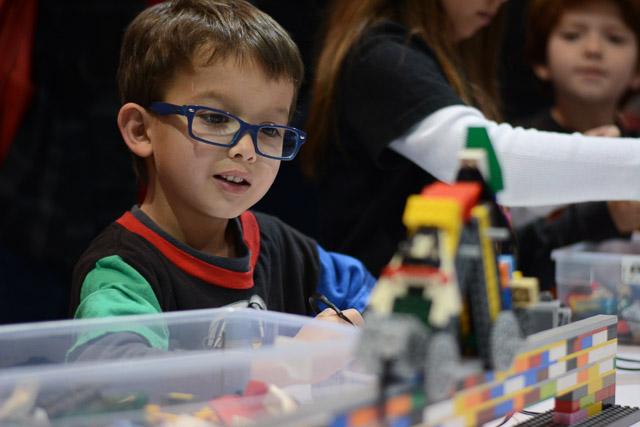 Families and children assembled Saturday at the Raleigh Convention Center at the LEGO KidsFest. The LEGO Fest featured a LEGO Model Museum of characters from fiction. Also featured was a brick pile for children to dive in and put bricks together. Two LEGO Master Builders, Steve Gerling and Chris Steininger, were present to teach tools of the trade that they have learned through their years of building with LEGOs. Gerling and Steininger built most of the models displayed in the Model Museum. As visitors exited the LEGO Fest, they had the opportunity to build a section of the United States and have it placed on a 65 feet long by 45 feet wide. Visitors could view this visitor-made model from a balcony.