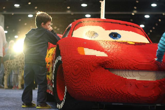 Families and children assembled Saturday at the Raleigh Convention Center at the LEGO KidsFest. The LEGO Fest featured a LEGO Model Museum of characters from fiction. Also featured was a brick pile for children to dive in and put bricks together. Two LEGO Master Builders, Steve Gerling and Chris Steininger, were present to teach tools of the trade that they have learned through their years of building with LEGOs. Gerling and Steininger built most of the models displayed in the Model Museum. As visitors exited the LEGO Fest, they had the opportunity to build a section of the United States and have it placed on a 65 feet long by 45 feet wide. Visitors could view this visitor-made model from a balcony.
