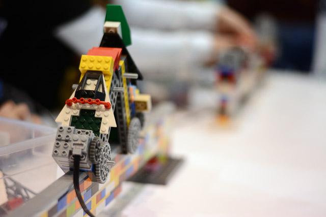 Families and children assembled Saturday at the Raleigh Convention Center at the LEGO KidsFest. The LEGO Fest featured a LEGO Model Museum of characters from fiction. Also featured was a brick pile for children to dive in and put bricks together. Two LEGO Master Builders, Steve Gerling and Chris Steininger, were present to teach tools of the trade that they have learned through their years of building with LEGOs. Gerling and Steininger built most of the models displayed in the Model Museum. As visitors exited the LEGO Fest, they had the opportunity to build a section of the United States and have it placed on a 65 feet long by 45 feet wide. Visitors could view this visitor-made model from a balcony.