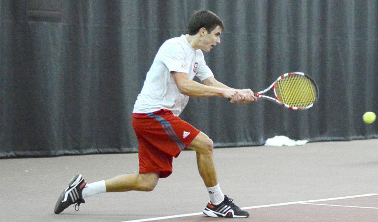 Junior Robbie Mudge hits a backhand in his singles match against junior Randy Phillips from UNC-Greensboro Jan. 19. Mudge defeated Phillips, 6-3, 6-1, and also won his doubles match with freshman Ian Dempster, defeating their opponents, 6-2. Mudge&#8217;s pair of wins helped N.C. State defeat the Spartans, 7-0.